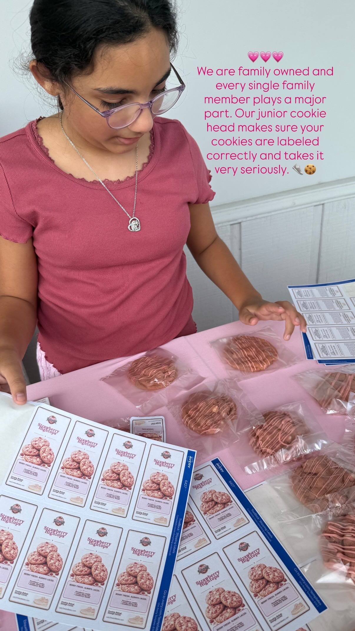 Mickie's niece Vivienne labeling packaged Strawberry Hightops cookies for LadySneaks Bakery