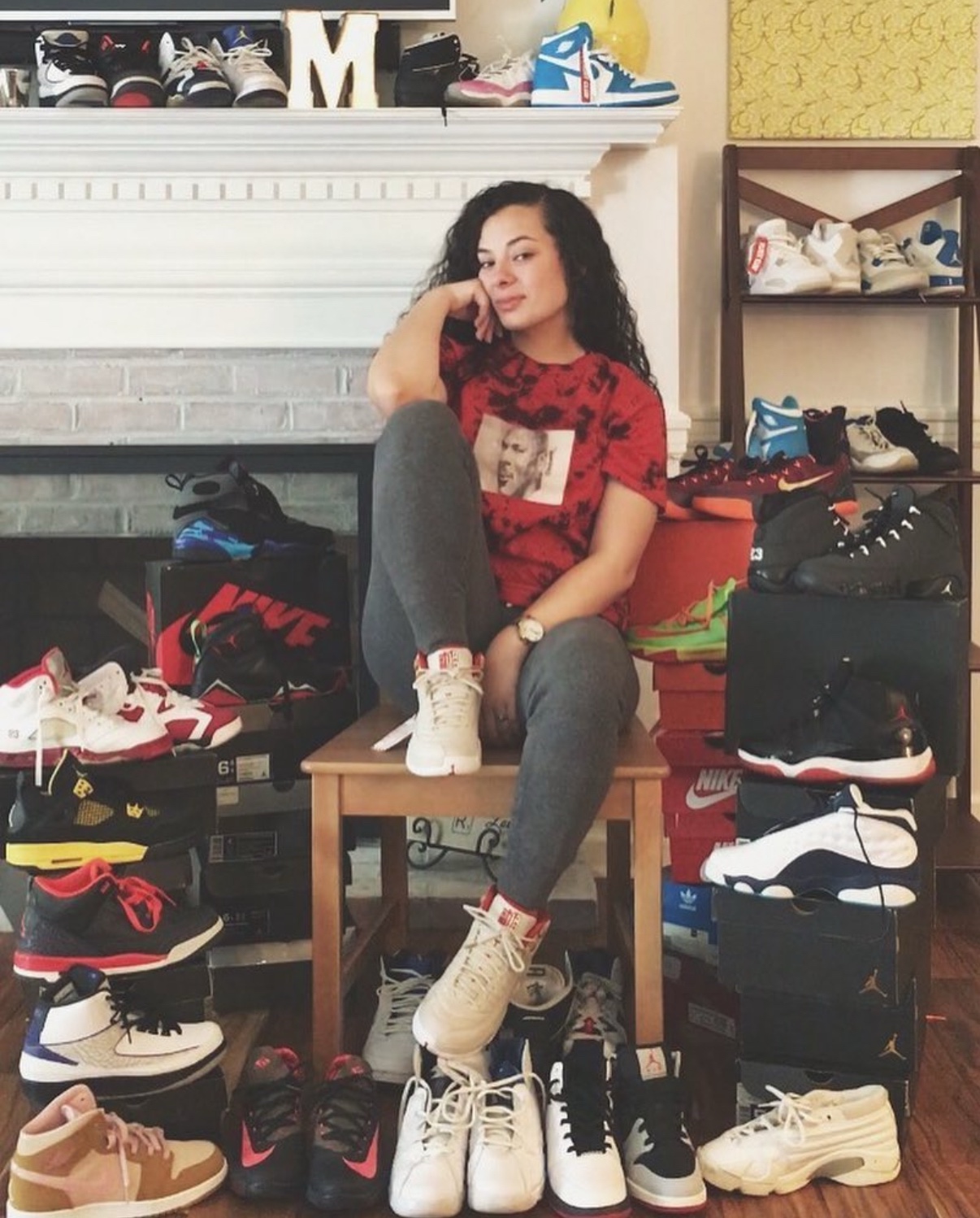 Mickie, the baker behind LadySneaks Bakery, with her sneaker collection